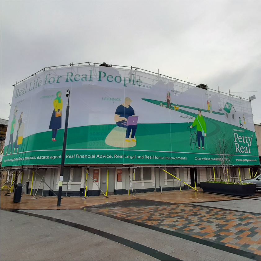 Large scale mesh banner on corner building site scaffolding