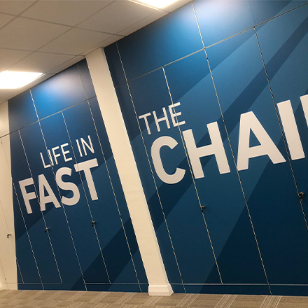 Self-adhesive vinyl wall graphics applied to internal office doors