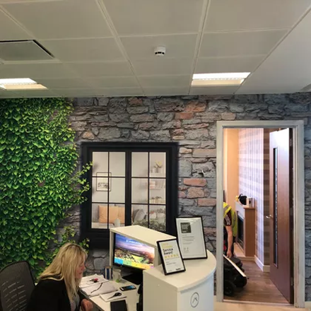 Office branding using white self-adhesive vinyl wall graphics