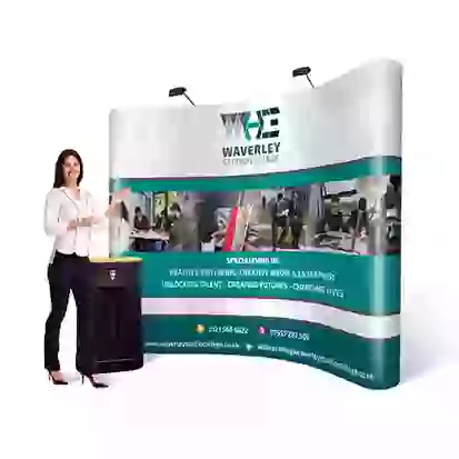 Woman stood next to podium by curved 3 x 4 pop up stand