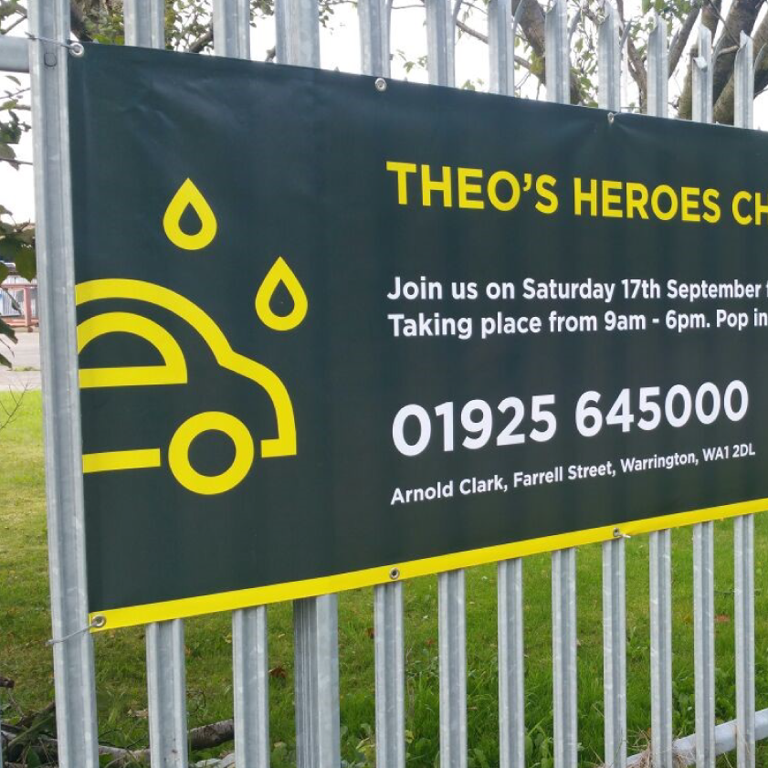 Colour PVC Banner Attached to a Fence by Eyelets