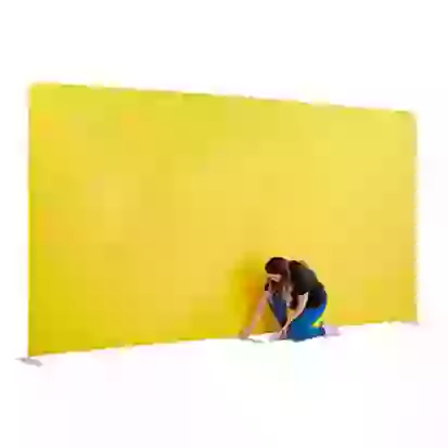Woman setting up large straight fabric backdrop