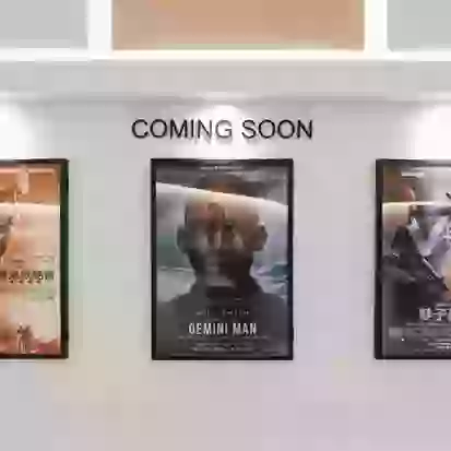 Indoor poster printing on advertising movies on cinema wall
